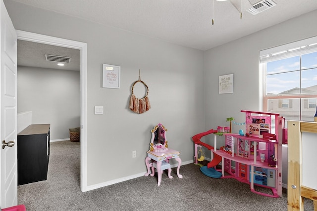 4823 Blackburn Rd NE, Rio Rancho, NM 87144 - rec room with carpet flooring, ceiling fan, and a textured ceiling