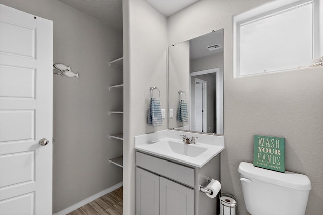 4823 Blackburn Rd NE, Rio Rancho, NM 87144 - half bathroom featuring vanity and wood finished floors