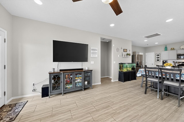 4823 Blackburn Rd NE, Rio Rancho, NM 87144 - living area with a ceiling fan, wood finish floors, and recessed lighting