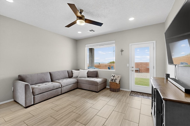 4823 Blackburn Rd NE, Rio Rancho, NM 87144 - living area with a ceiling fan, recessed lighting, wood tiled floors, and a textured ceiling