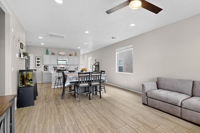 4823 Blackburn Rd NE, Rio Rancho, NM 87144 - dining room featuring a ceiling fan and recessed lighting