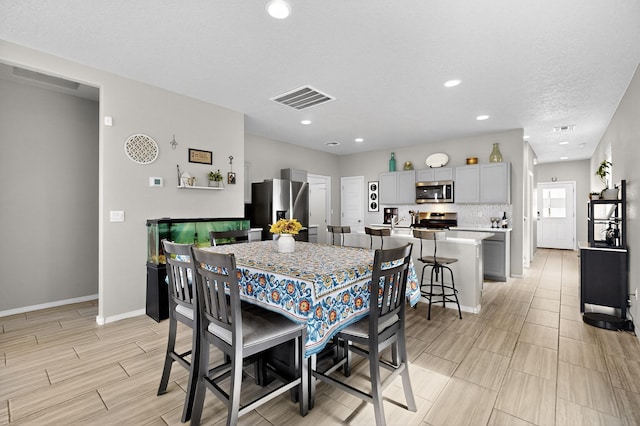 4823 Blackburn Rd NE, Rio Rancho, NM 87144 - dining room featuring wood finish floors and recessed lighting