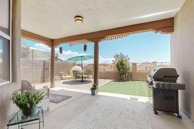 1324 Wilkes Way SE, Rio Rancho, NM 87124 - fenced backyard featuring a patio area and area for grilling