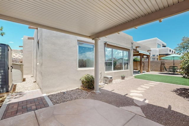 1324 Wilkes Way SE, Rio Rancho, NM 87124 - fenced backyard with a patio area