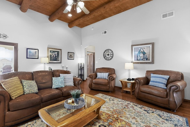1324 Wilkes Way SE, Rio Rancho, NM 87124 - living room featuring a wooden ceiling with exposed beams, ceiling fan, arched walkways, wood finished floors, and a high ceiling