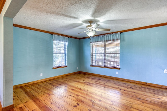 10 Quail Run Rd, Tijeras, NM 87059 - empty room featuring crown molding, hardwood / wood-style floors, a ceiling fan, and a textured ceiling