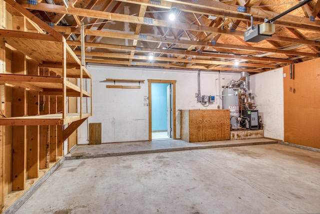 10 Quail Run Rd, Tijeras, NM 87059 - garage featuring a garage door opener and secured water heater