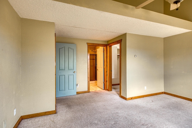 10 Quail Run Rd, Tijeras, NM 87059 - carpeted empty room with baseboards and a textured ceiling