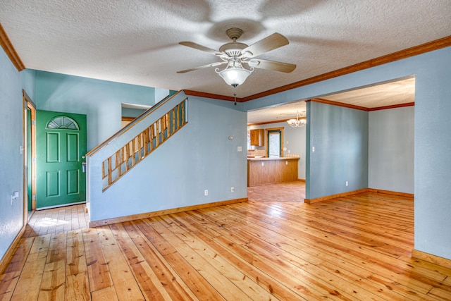 10 Quail Run Rd, Tijeras, NM 87059 - unfurnished living room with hardwood / wood-style flooring, ornamental molding, a chandelier, a ceiling fan, and a textured ceiling