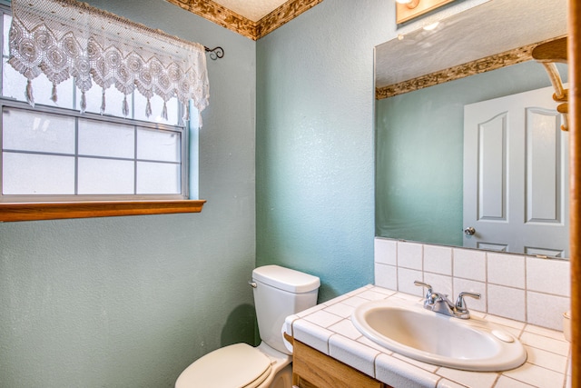 10 Quail Run Rd, Tijeras, NM 87059 - bathroom with a textured wall, vanity, and backsplash