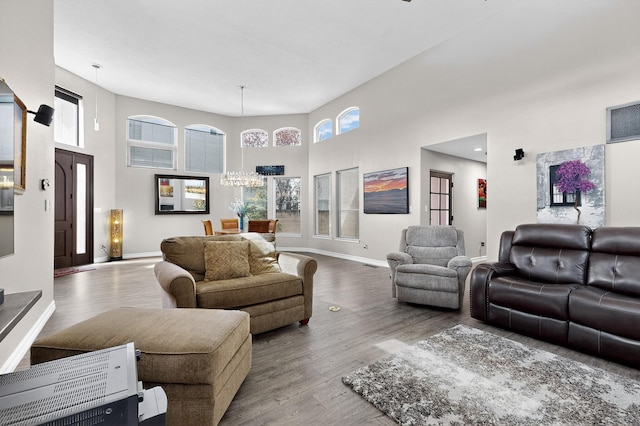 6205 Peachtree Pl NE, Albuquerque, NM 87111 - living area featuring a high ceiling, wood finished floors, and a chandelier