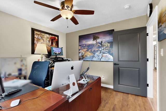 6205 Peachtree Pl NE, Albuquerque, NM 87111 - home office with wood finished floors and a ceiling fan