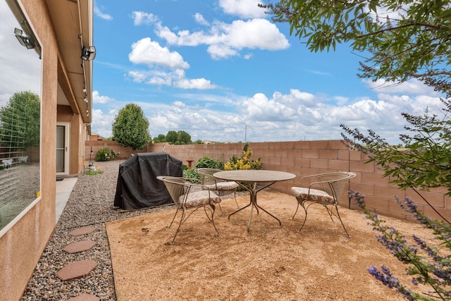 2660 Firewheel Ave SW, Los Lunas, NM 87031 - fenced backyard with grilling area and a patio area