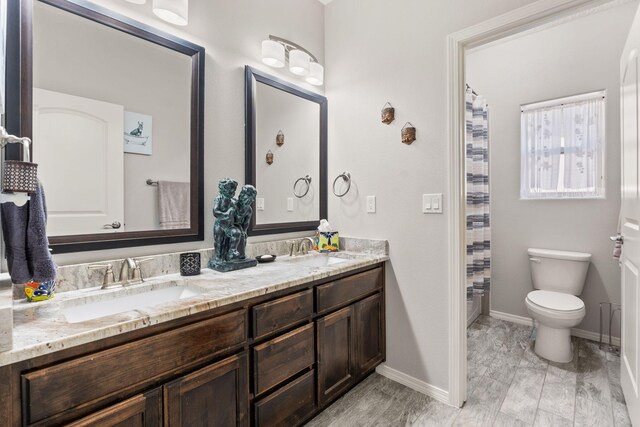 2660 Firewheel Ave SW, Los Lunas, NM 87031 - full bathroom featuring double vanity and a shower with shower curtain