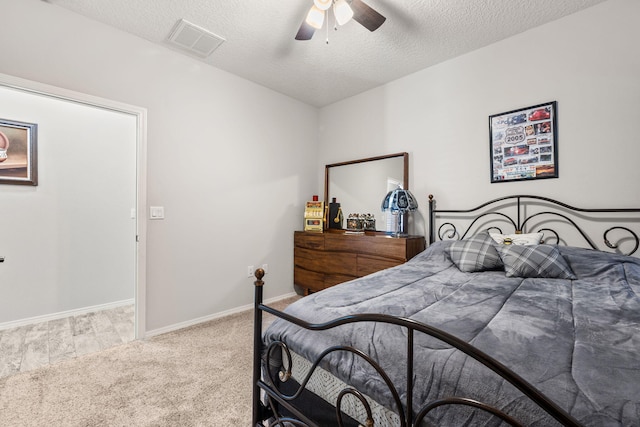 2660 Firewheel Ave SW, Los Lunas, NM 87031 - bedroom featuring carpet, a textured ceiling, and ceiling fan