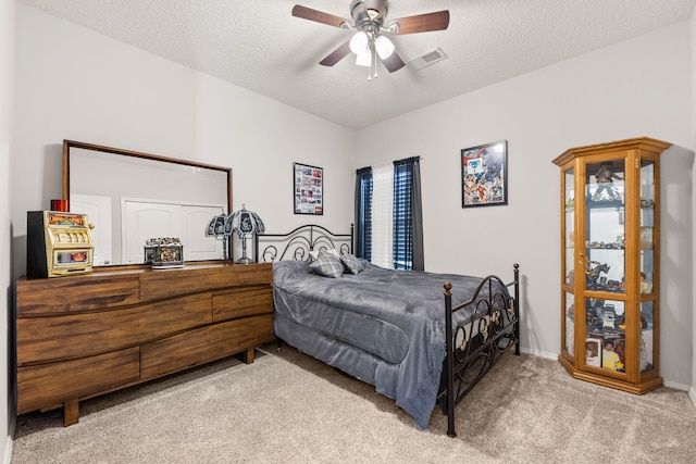 2660 Firewheel Ave SW, Los Lunas, NM 87031 - bedroom featuring carpet, a textured ceiling, and a ceiling fan