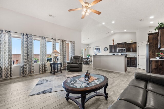 2660 Firewheel Ave SW, Los Lunas, NM 87031 - living area featuring ceiling fan, light wood finished floors, recessed lighting, and high vaulted ceiling