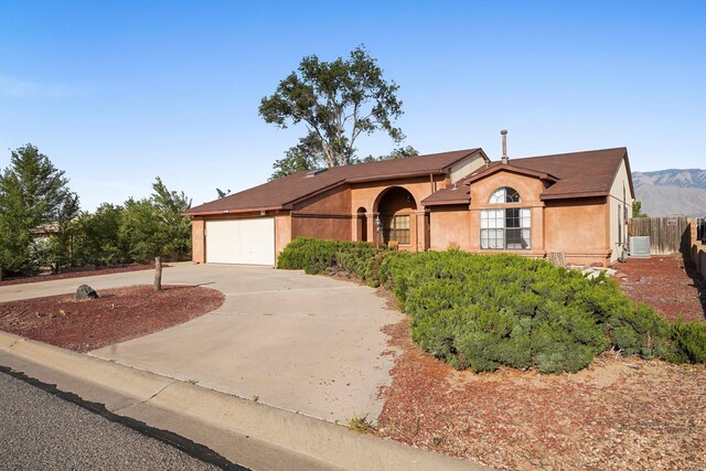 6268 Apache Plume Rd NE, Rio Rancho, NM 87144 - view of front of home featuring driveway, stucco siding, and an attached garage
