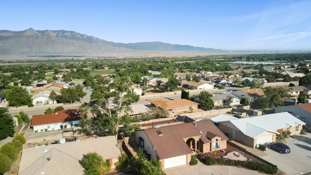 6268 Apache Plume Rd NE, Rio Rancho, NM 87144 - aerial perspective of suburban area with a mountainous background