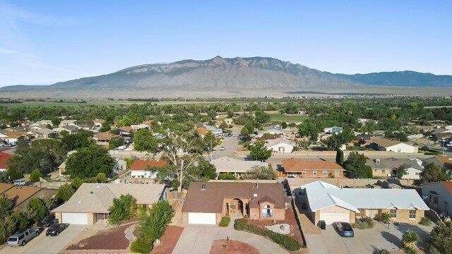 6268 Apache Plume Rd NE, Rio Rancho, NM 87144 - aerial view of residential area featuring a mountain backdrop