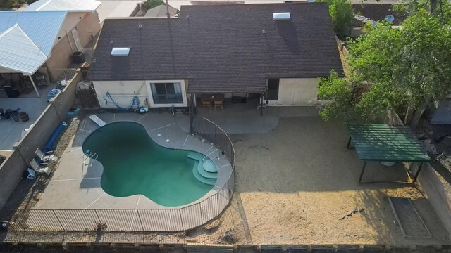 6268 Apache Plume Rd NE, Rio Rancho, NM 87144 - view of swimming pool featuring a patio area and a fenced backyard