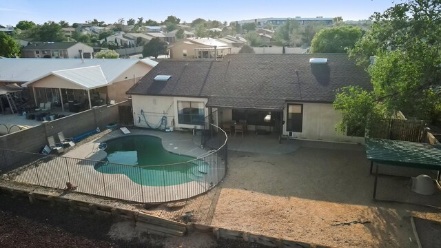 6268 Apache Plume Rd NE, Rio Rancho, NM 87144 - view of pool featuring a fenced backyard, a patio area, and a residential view
