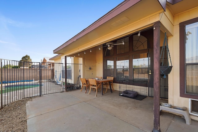 6268 Apache Plume Rd NE, Rio Rancho, NM 87144 - view of patio with outdoor dining space and a ceiling fan