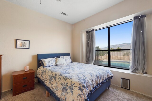 6268 Apache Plume Rd NE, Rio Rancho, NM 87144 - carpeted bedroom with baseboards and a mountain view
