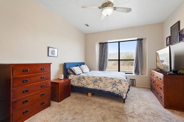 6268 Apache Plume Rd NE, Rio Rancho, NM 87144 - bedroom with light colored carpet and ceiling fan