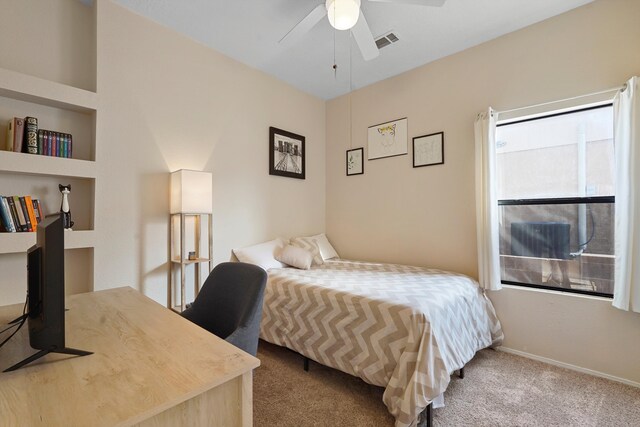 6268 Apache Plume Rd NE, Rio Rancho, NM 87144 - carpeted bedroom with a ceiling fan and baseboards