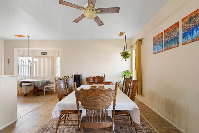 6268 Apache Plume Rd NE, Rio Rancho, NM 87144 - dining space featuring a chandelier and a ceiling fan