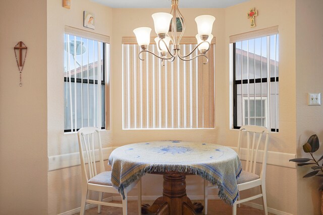6268 Apache Plume Rd NE, Rio Rancho, NM 87144 - dining space featuring a chandelier and baseboards