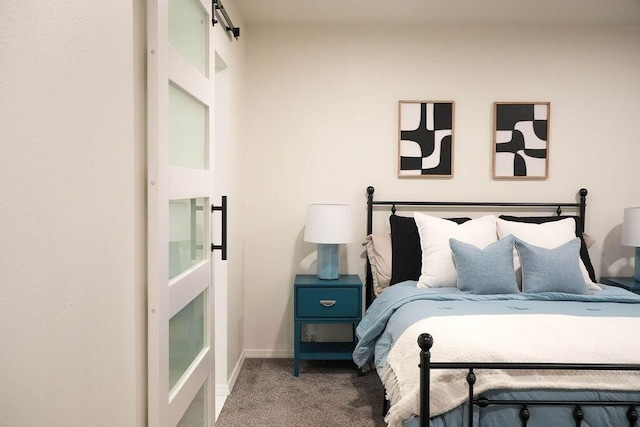 4441 Kellia Ln NE, Albuquerque, NM 87111 - carpeted bedroom featuring a barn door and baseboards