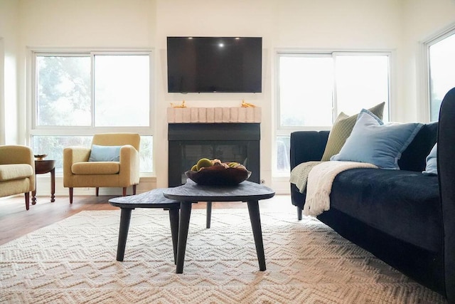 4441 Kellia Ln NE, Albuquerque, NM 87111 - living room with a brick fireplace and light wood finished floors