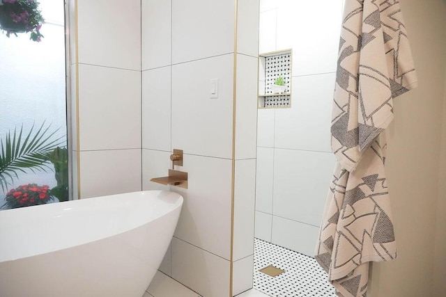 4441 Kellia Ln NE, Albuquerque, NM 87111 - bathroom with a tile shower, a freestanding tub, and tile walls