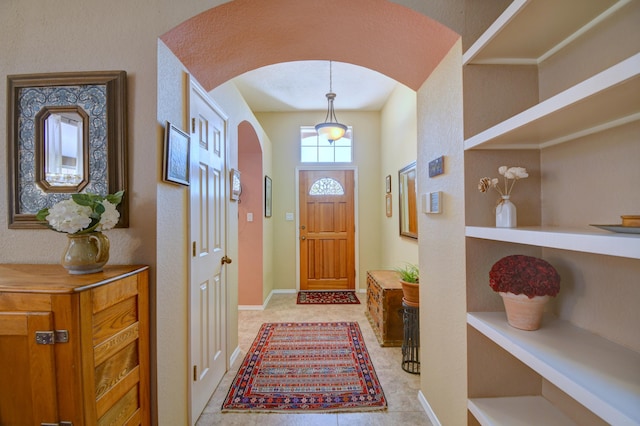 6749 Kelly Ann Rd NE, Albuquerque, NM 87109 - foyer with arched walkways and baseboards