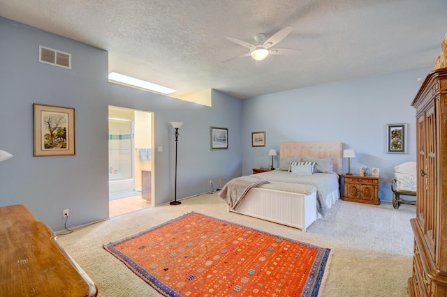 6749 Kelly Ann Rd NE, Albuquerque, NM 87109 - carpeted bedroom with a textured ceiling, ceiling fan, and ensuite bath