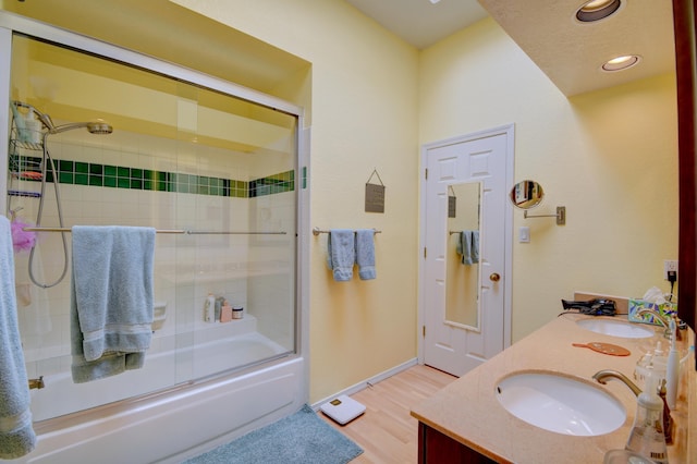 6749 Kelly Ann Rd NE, Albuquerque, NM 87109 - bathroom with enclosed tub / shower combo, wood finished floors, double vanity, and recessed lighting