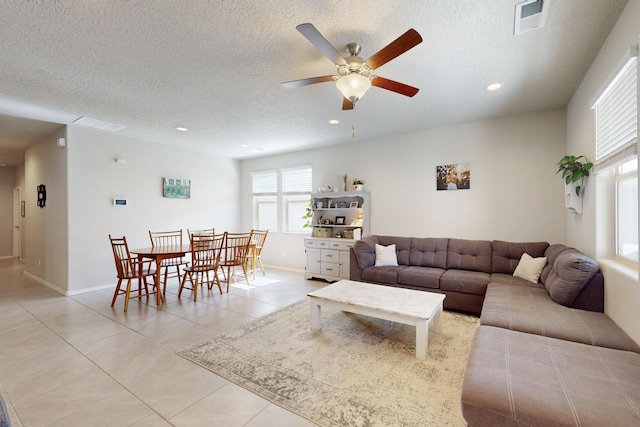 1854 Valle Vista Rd NW, Los Lunas, NM 87031 - living room featuring light tile patterned flooring, a ceiling fan, recessed lighting, and a textured ceiling