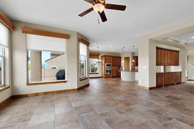 2413 Desert View Rd NE, Rio Rancho, NM 87144 - unfurnished living room with a ceiling fan and recessed lighting