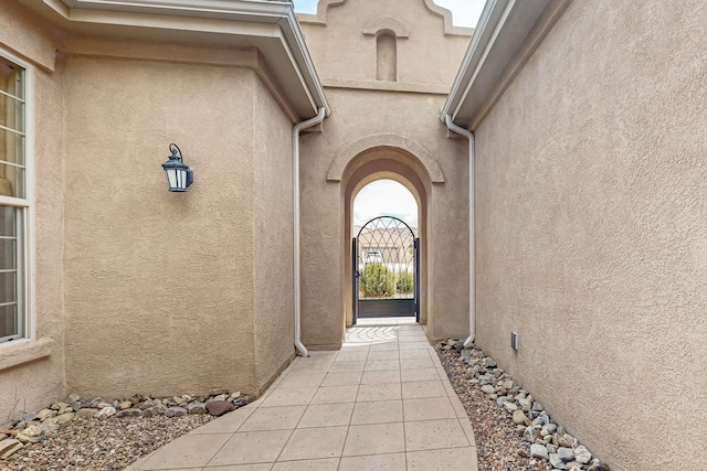 2413 Desert View Rd NE, Rio Rancho, NM 87144 - doorway to property featuring stucco siding and a gate