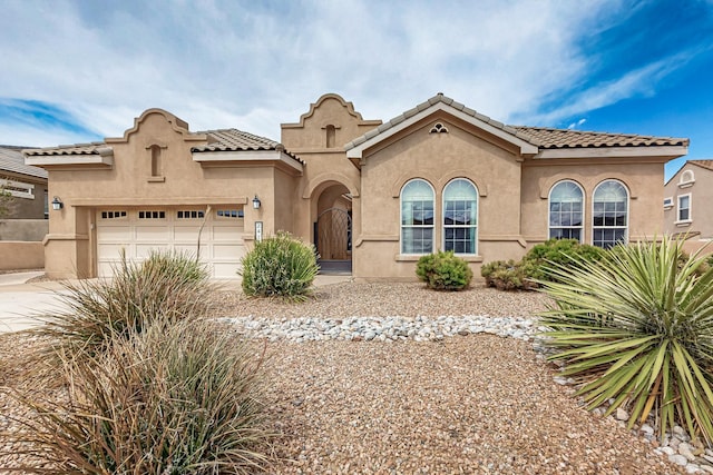 2413 Desert View Rd NE, Rio Rancho, NM 87144 - mediterranean / spanish home with stucco siding, concrete driveway, and a tile roof