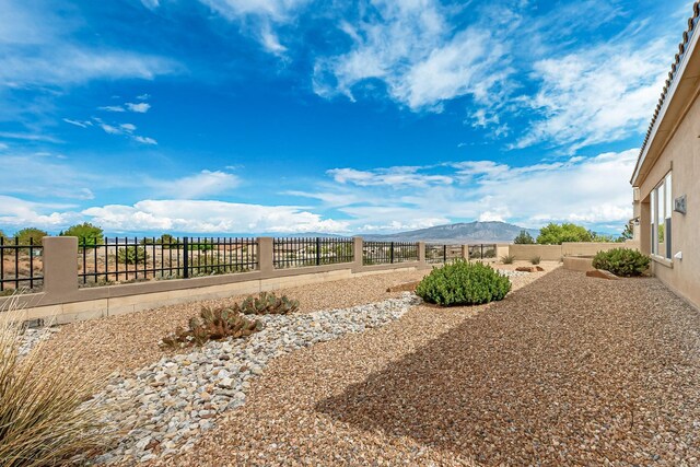 2413 Desert View Rd NE, Rio Rancho, NM 87144 - fenced backyard featuring a mountain view
