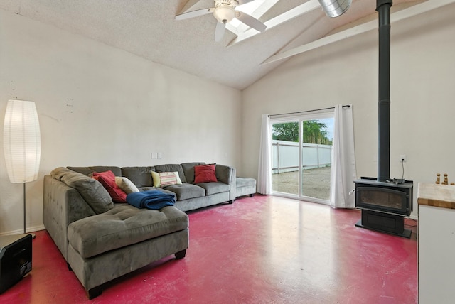 6205 Darlene Pl SW, Albuquerque, NM 87105 - living room with a wood stove, high vaulted ceiling, ceiling fan, finished concrete flooring, and beam ceiling