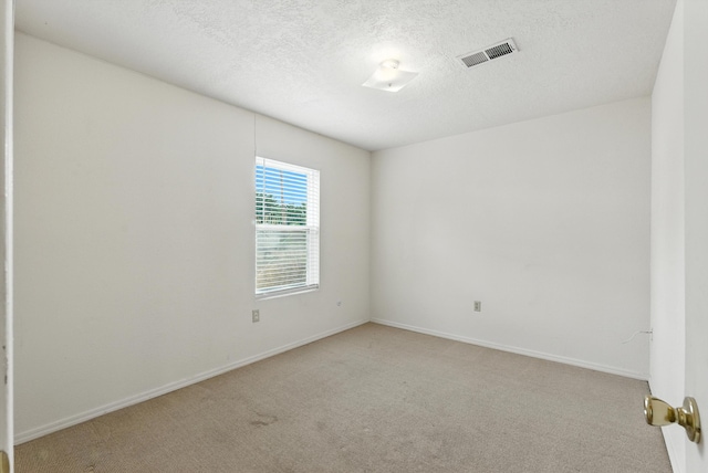 6205 Darlene Pl SW, Albuquerque, NM 87105 - empty room with light colored carpet and a textured ceiling