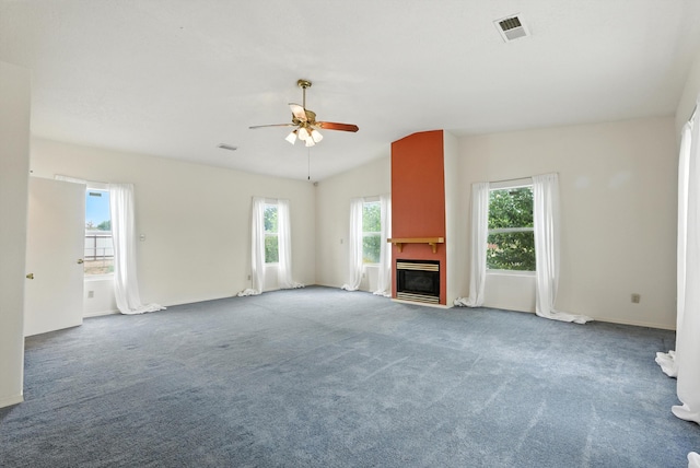 6205 Darlene Pl SW, Albuquerque, NM 87105 - unfurnished living room with plenty of natural light, vaulted ceiling, ceiling fan, carpet flooring, and a fireplace