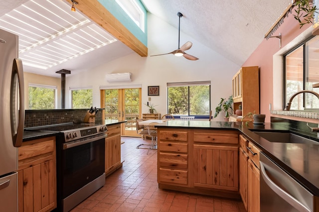 23 Cooper Rd, Cedar Crest, NM 87008 - kitchen with appliances with stainless steel finishes, a wall mounted air conditioner, dark countertops, brick floors, and a peninsula