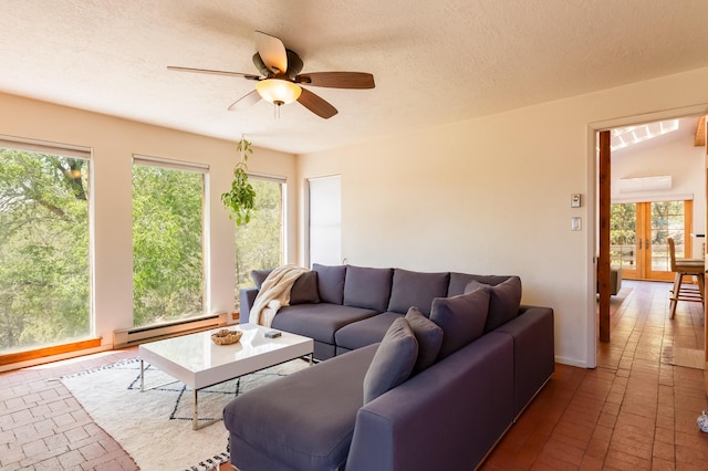23 Cooper Rd, Cedar Crest, NM 87008 - living area with baseboard heating, a ceiling fan, brick floors, and a textured ceiling