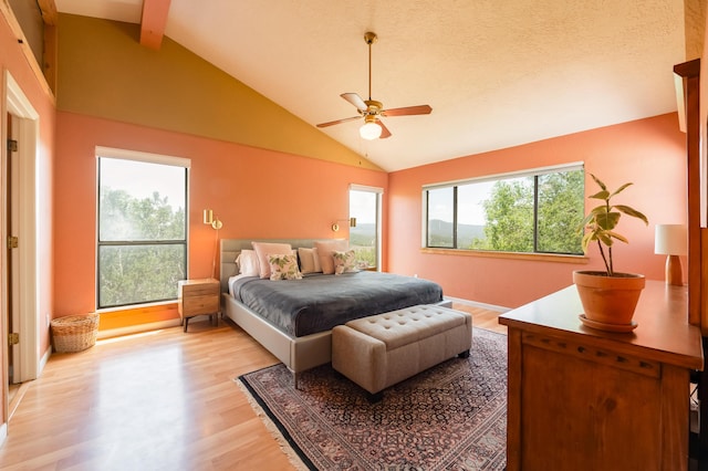 23 Cooper Rd, Cedar Crest, NM 87008 - bedroom with light wood-style flooring, multiple windows, beamed ceiling, high vaulted ceiling, and ceiling fan