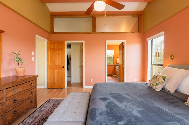 23 Cooper Rd, Cedar Crest, NM 87008 - bedroom featuring light wood-style floors, multiple windows, a baseboard radiator, and connected bathroom